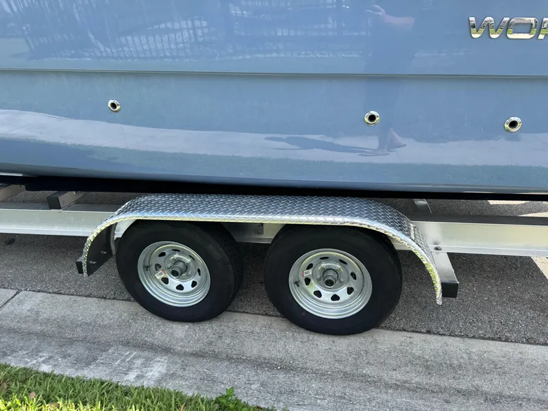 Slide: The Image of 2022 World Cat 230 SD boat on trailer with dual wheels, side view. - 6