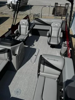Slide: The Image of 2025 South Bay S224UL pontoon boat interior with gray seating and modern design. - 3