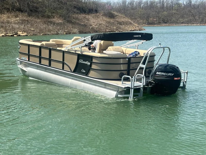 Slide: The Image of 2019 Bentley Pontoons 223 on a lake with Mercury outboard motor. - 17
