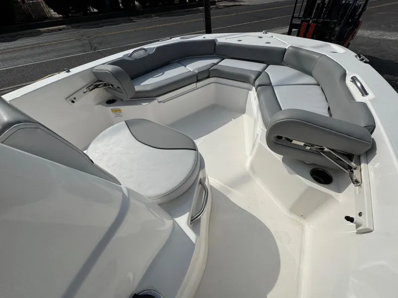 Slide: The Image of 2023 NauticStar 191 Hybrid boat interior with gray cushioned seating. - 9