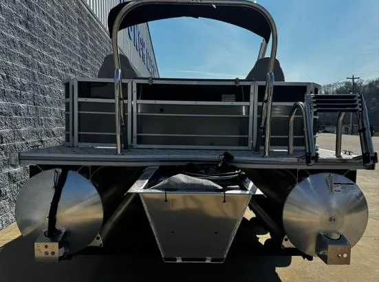 Slide: The Image of 2025 South Bay 224RS LE pontoon boat rear view, showcasing dual pontoons and ladder. - 9