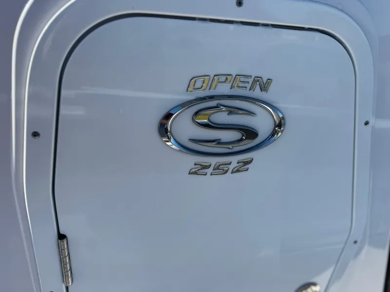 Slide: The Image of 2024 Sportsman Open 252 Center Console logo on boat hatch. - 13