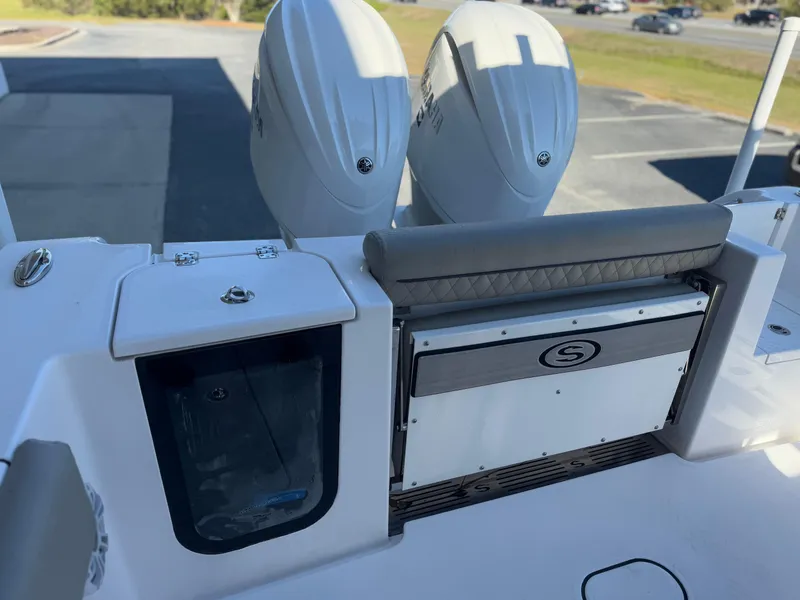 Slide: The Image of 2024 Sportsman Open 252 Center Console boat with dual engines and seating area. - 14