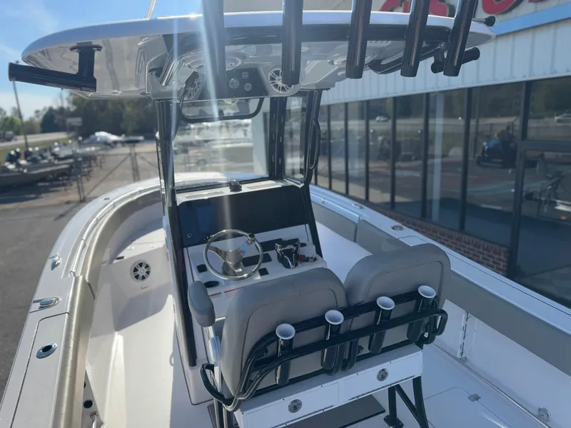 Slide: The Image of 2024 Sportsman Open 252 Center Console boat with dual seats and steering console. - 4