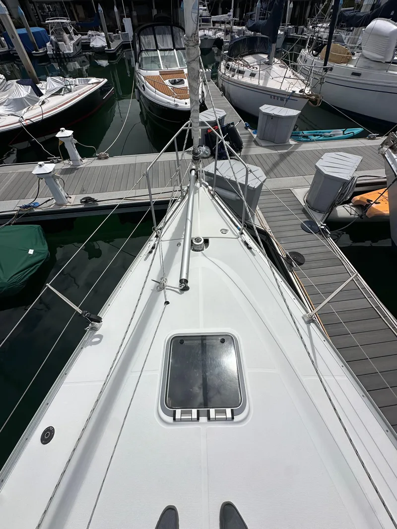 Slide: The Image of 2003 Jeanneau Sun Odyssey 32 sailboat docked in marina, view from deck. - 15