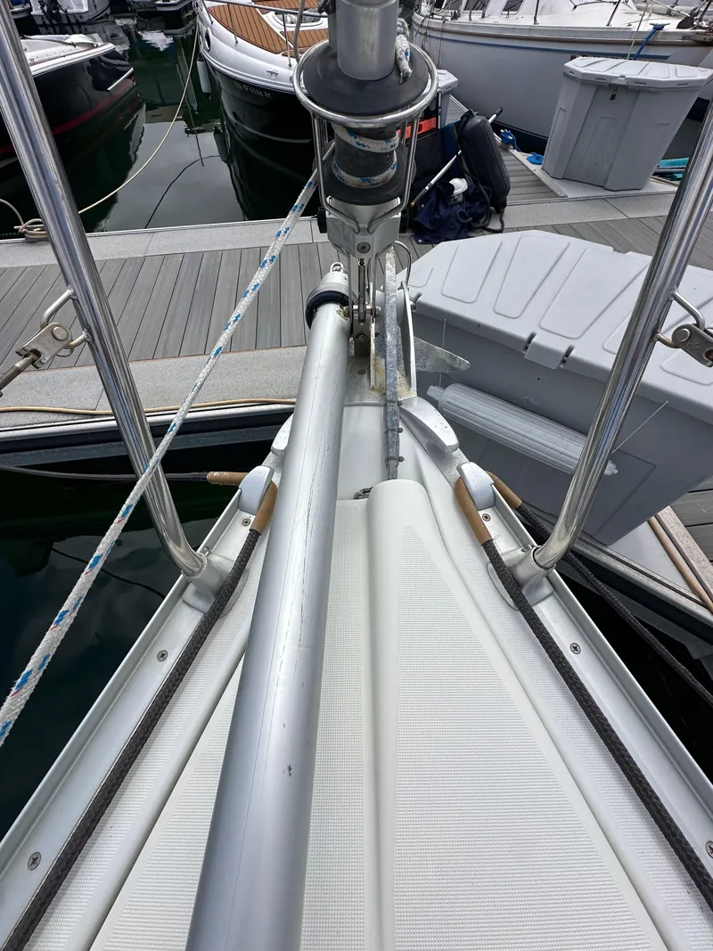 Slide: The Image of 2003 Jeanneau Sun Odyssey 32 sailboat bow at dock, featuring deck and rigging details. - 17