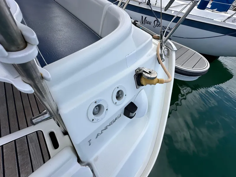 Slide: The Image of Jeanneau Sun Odyssey 32, 2003 model, docked with visible power connections. - 28