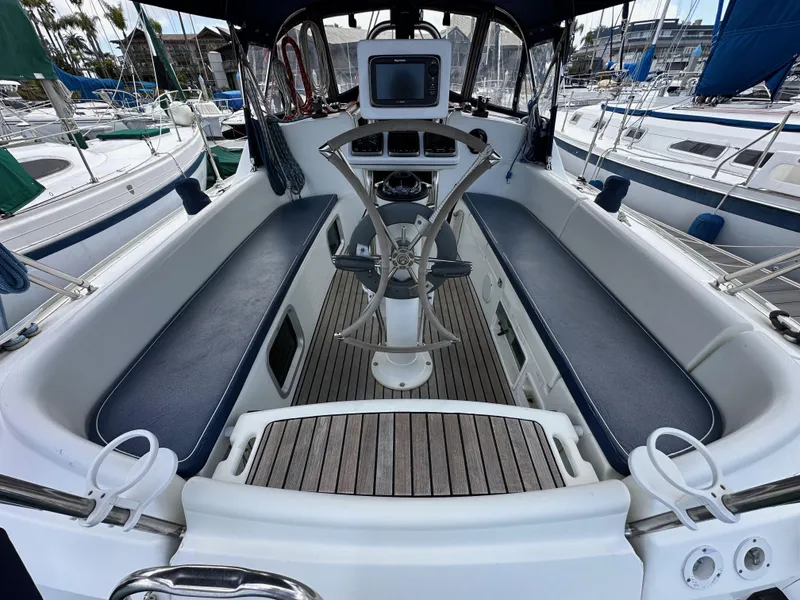 Slide: The Image of Cockpit of 2003 Jeanneau Sun Odyssey 32 sailboat with steering wheel and seating. - 30