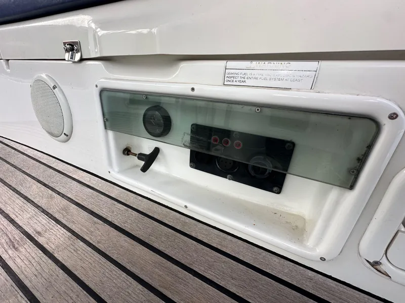 Slide: The Image of Control panel on 2003 Jeanneau Sun Odyssey 32 sailboat with wooden deck. - 33