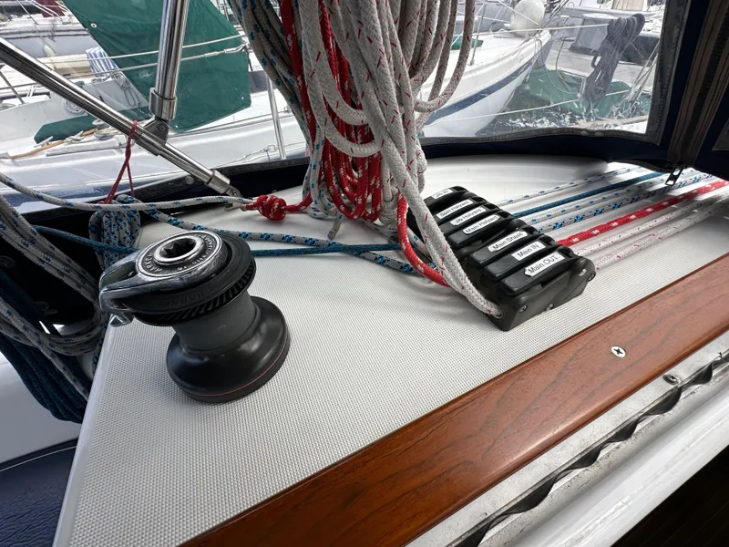 Slide: The Image of Deck of 2003 Jeanneau Sun Odyssey 32 sailboat with winch and rope clutches. - 40