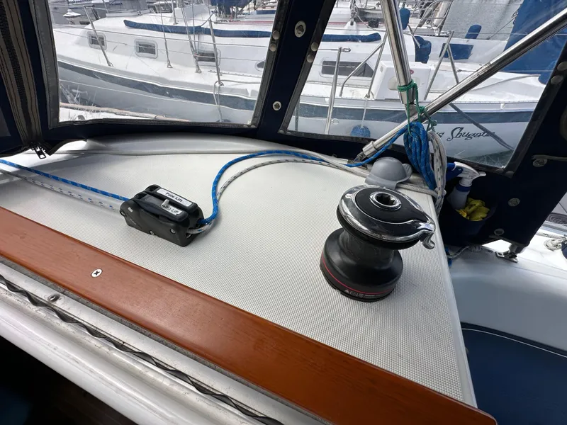 Slide: The Image of Cockpit view of 2003 Jeanneau Sun Odyssey 32 sailboat with winch and ropes. - 41