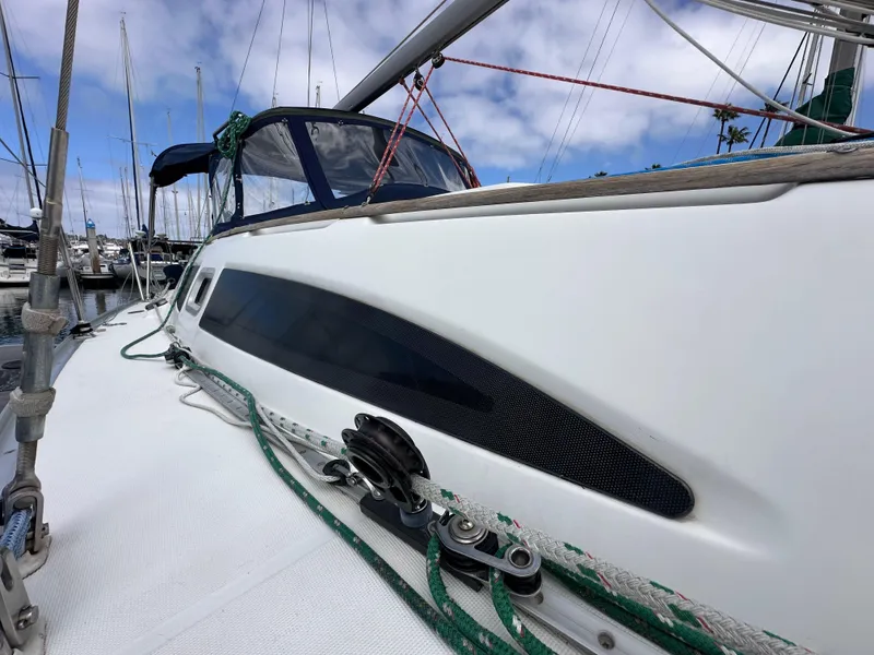 Slide: The Image of Jeanneau Sun Odyssey 32 sailboat, 2003 model, docked with visible rigging and deck details. - 7