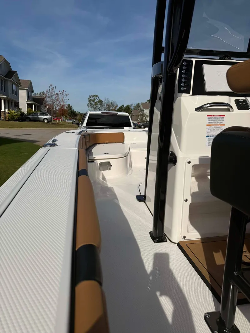 Slide: The Image of 2024 Robalo 226 Cayman boat interior with modern console and seating. - 6