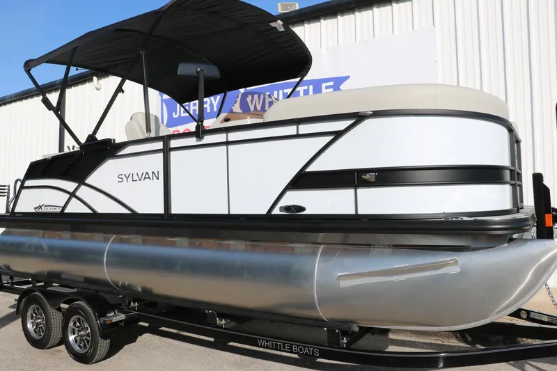 Slide: The Image of 2025 Sylvan Mirage X X1 CLZ DH pontoon boat with sleek design and canopy. - 12