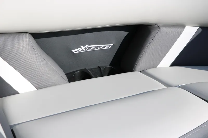 Slide: The Image of 2025 Sylvan Mirage X X1 CLZ DH interior with X Series branding and sleek seating. - 26