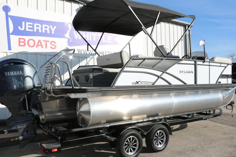 Slide: The Image of 2025 Sylvan Mirage X X1 CLZ DH pontoon boat on trailer at dealership. - 4