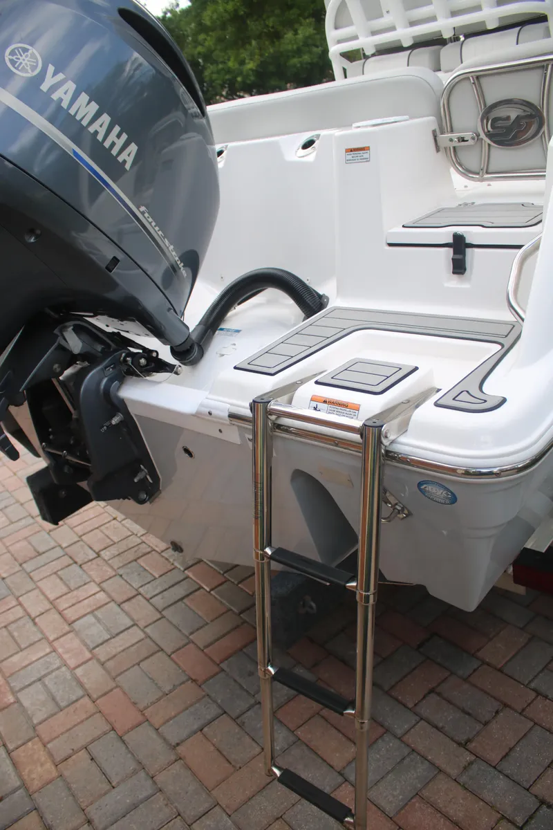 Slide: The Image of 2023 Sea Fox 228 boat with Yamaha engine and boarding ladder on a brick surface. - 11