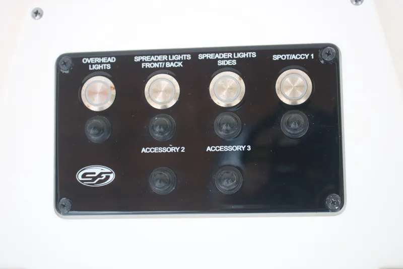 Slide: The Image of Control panel of 2023 Sea Fox 228 boat with labeled switches for lights and accessories. - 16