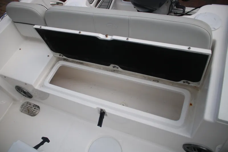 Slide: The Image of 2023 Sea Fox 228 boat storage compartment with open lid, showcasing spacious interior. - 19