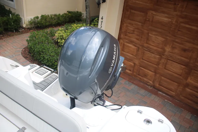Slide: The Image of 2023 Sea Fox 228 boat with Yamaha outboard motor in driveway. - 21