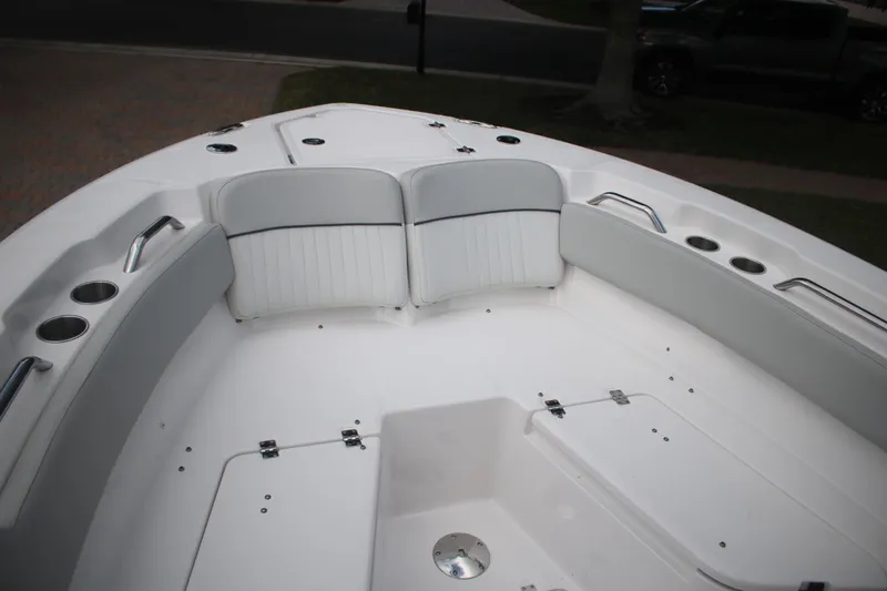 Slide: The Image of 2023 Sea Fox 228 boat interior with white seating and cup holders. - 25