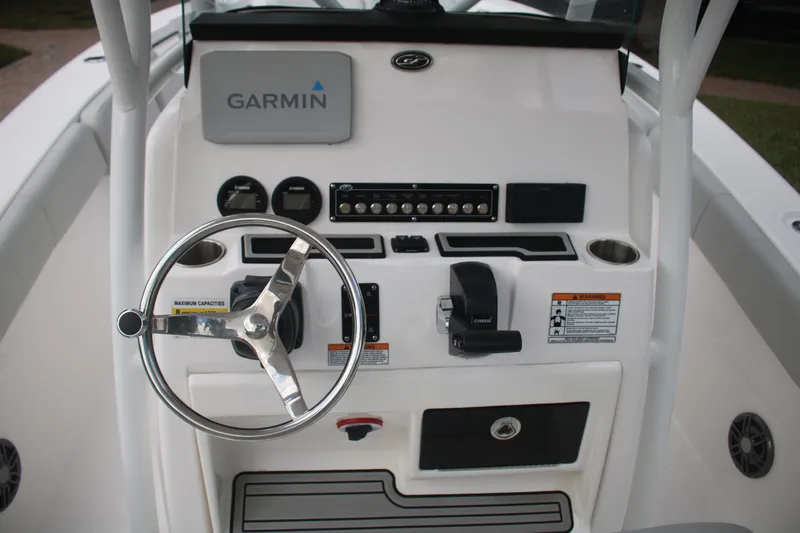 Slide: The Image of 2023 Sea Fox 228 boat console with Garmin navigation and steering wheel. - 26