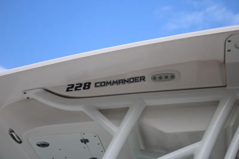 Slide: The Image of 2023 Sea Fox 228 Commander boat detail against blue sky. - 4