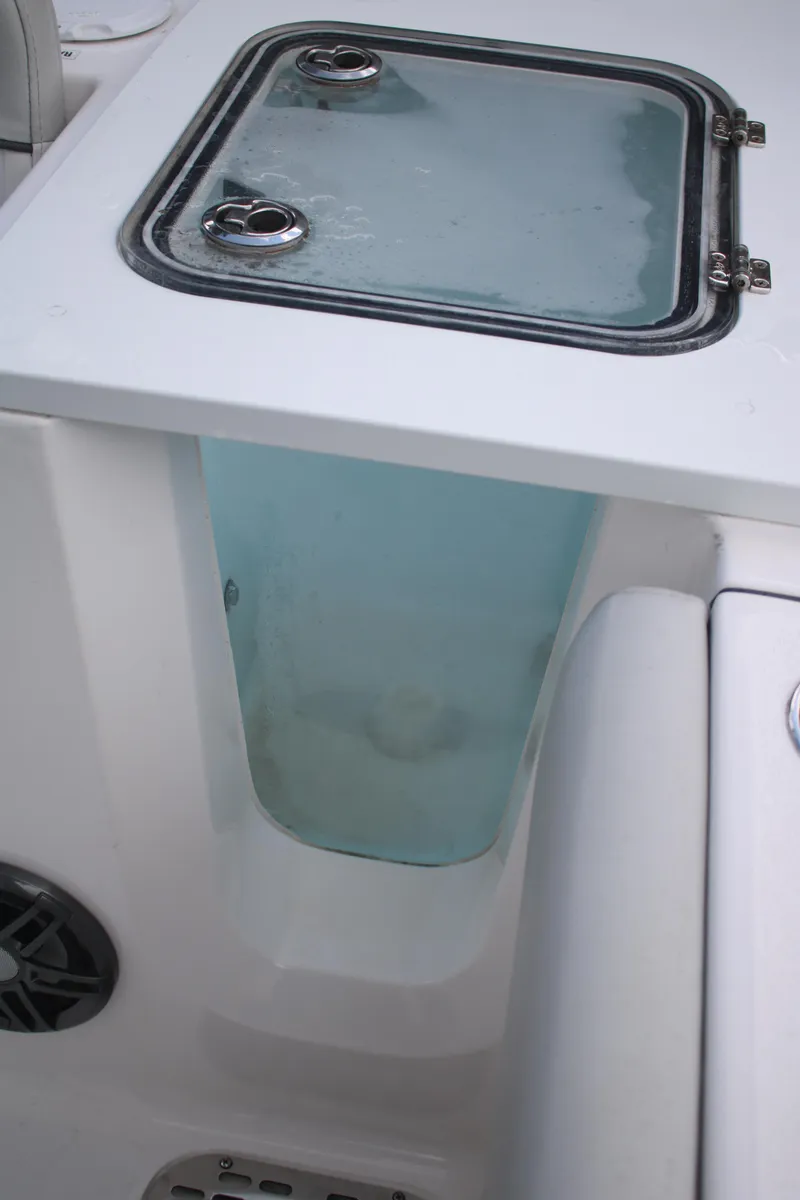 Slide: The Image of 2023 Sea Fox 228 boat livewell with transparent lid and secure latches. - 9