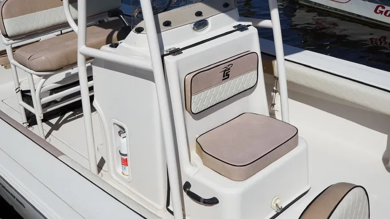Slide: The Image of 2023 Carolina Skiff 24 Ultra Elite boat interior with seating and console. - 4