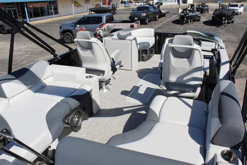 Slide: The Image of 2025 Avalon LSZ 2185 Quad Lounge Shift pontoon boat interior with gray seating and modern design. - 18