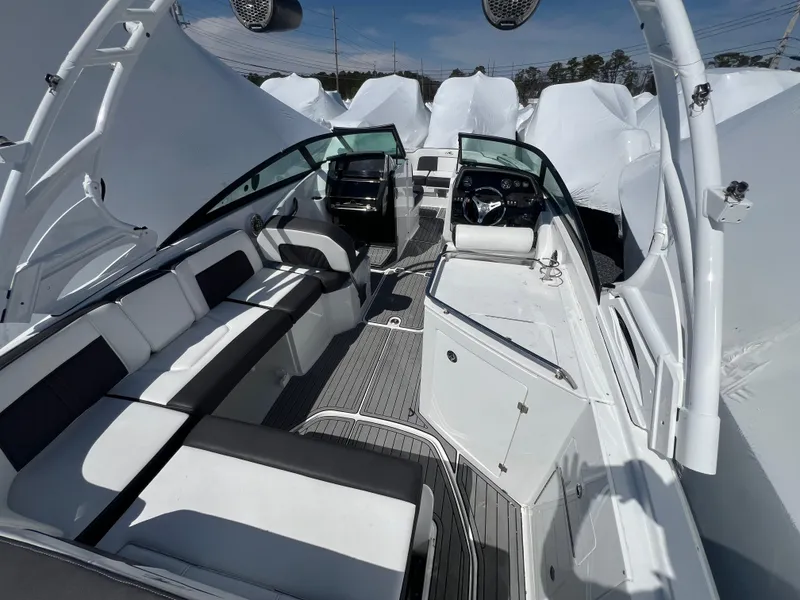 Slide: The Image of 2022 Monterey M65 boat interior with sleek seating and modern dashboard design. - 11