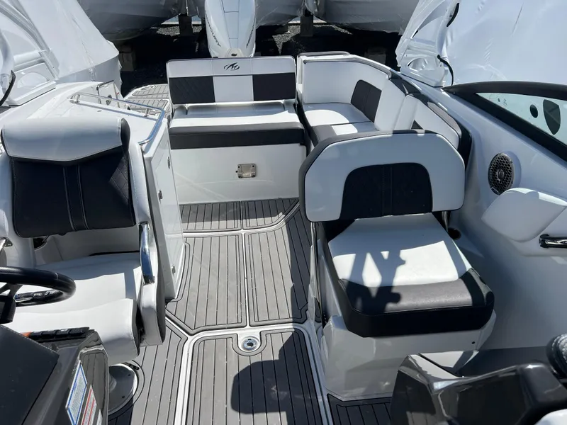 Slide: The Image of Interior of a 2022 Monterey M65 boat with sleek seating and modern design. - 17