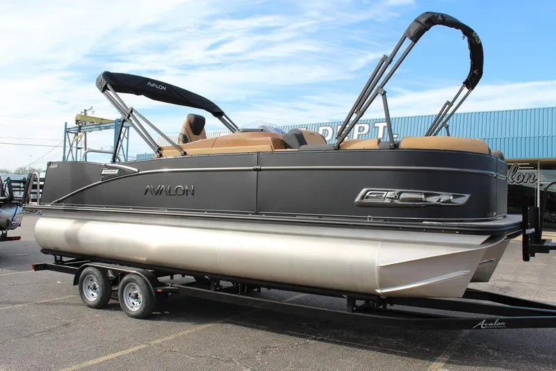 Slide: The Image of 2025 Avalon Catalina Versatile Rear Bench 23 FT pontoon boat on trailer. - 1