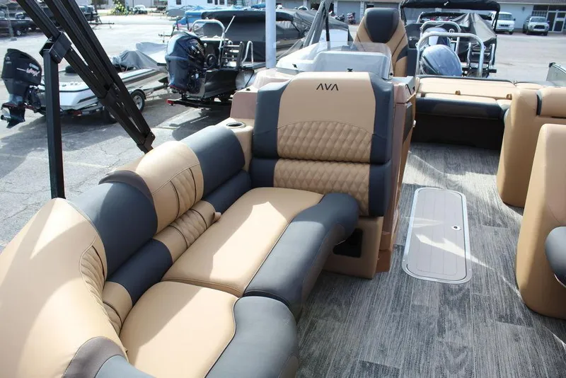 Slide: The Image of 2025 Avalon Catalina Versatile Rear Bench 23 FT with luxurious tan and gray seating. - 11
