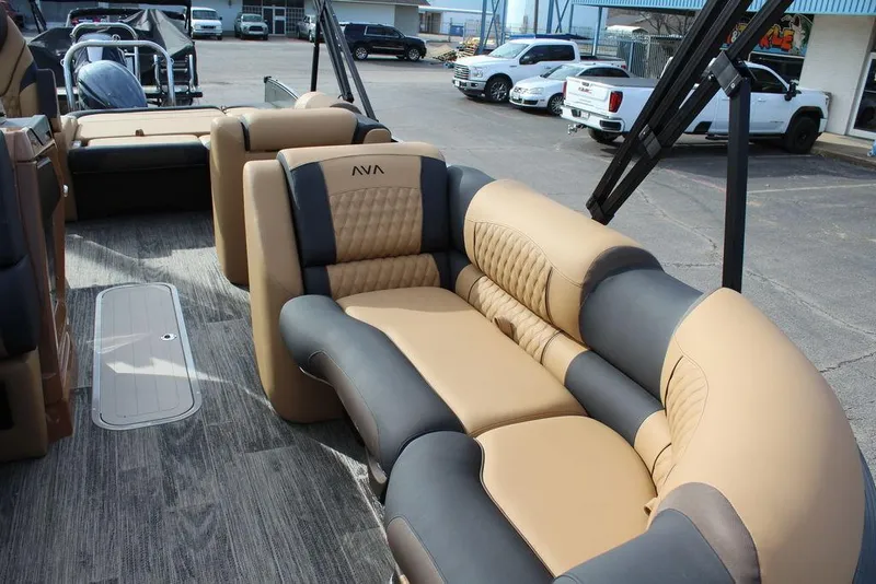 Slide: The Image of 2025 Avalon Catalina Versatile Rear Bench 23 FT with luxurious tan and gray seating. - 12