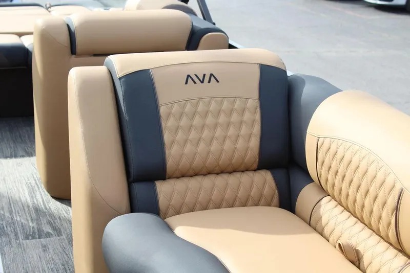 Slide: The Image of Luxurious seating on 2025 Avalon Catalina Versatile Rear Bench 23 FT boat, featuring elegant tan and gray upholstery. - 14