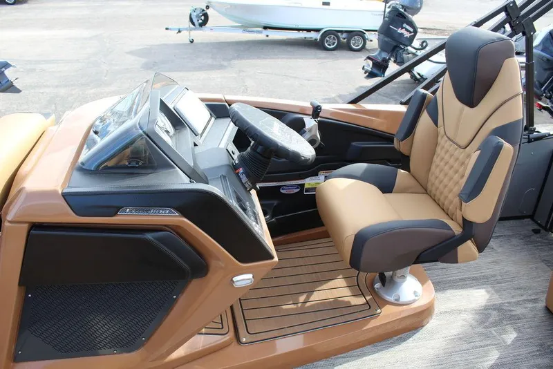 Slide: The Image of 2025 Avalon Catalina Versatile Rear Bench 23 FT boat cockpit with modern steering and seating. - 16