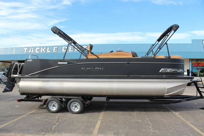 Slide: The Image of 2025 Avalon Catalina Versatile Rear Bench 23 FT pontoon boat on trailer. - 2