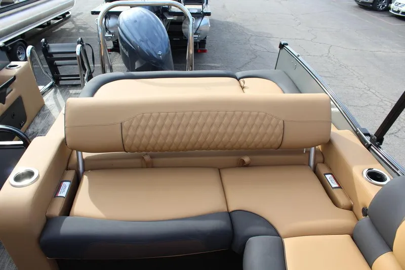 Slide: The Image of 2025 Avalon Catalina Versatile Rear Bench, 23 FT, luxurious tan and black seating, cup holders. - 22