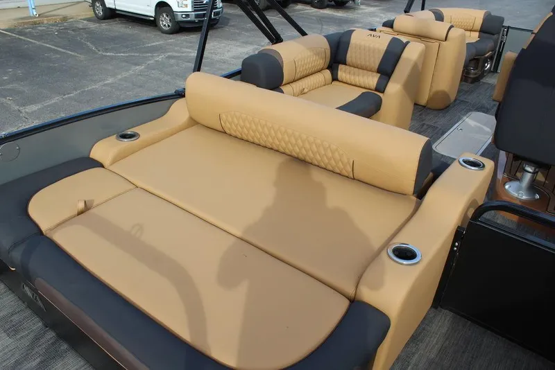 Slide: The Image of 2025 Avalon Catalina Versatile Rear Bench 23 FT with luxurious tan and black seating. - 23