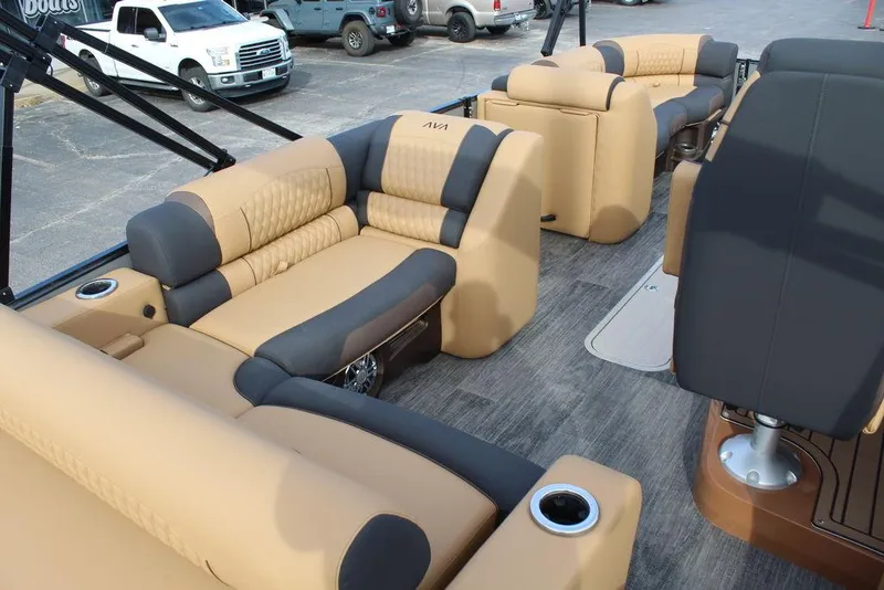 Slide: The Image of 2025 Avalon Catalina Versatile Rear Bench 23 FT with luxurious tan and black seating. - 27