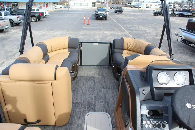Slide: The Image of 2025 Avalon Catalina Versatile Rear Bench 23 FT pontoon boat interior with tan and black seating. - 28