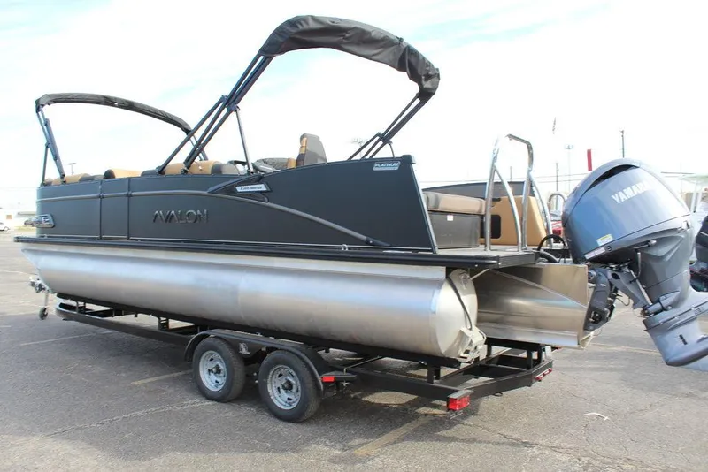 Slide: The Image of 2025 Avalon Catalina Versatile Rear Bench 23 FT pontoon boat on trailer, featuring Yamaha outboard motor. - 4