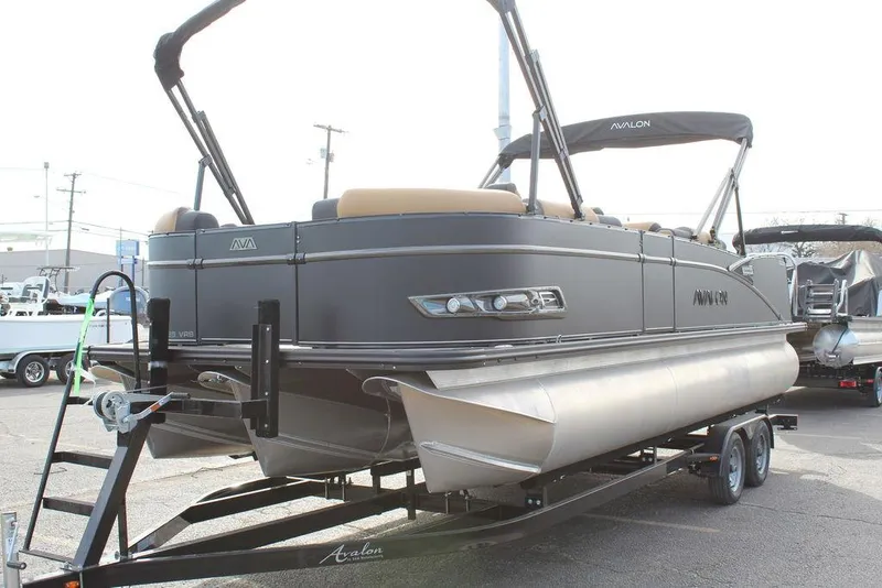 Slide: The Image of 2025 Avalon Catalina Versatile Rear Bench 23 FT pontoon boat on trailer, side view. - 6