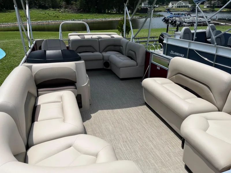 Slide: The Image of 2024 Landau Island Breeze 232 Cruise pontoon boat with spacious seating and elegant design. - 14