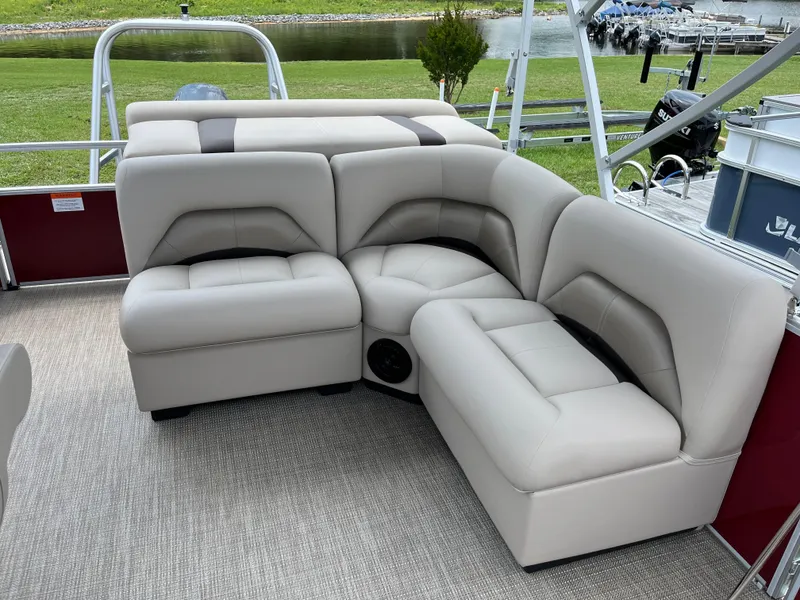 Slide: The Image of 2024 Landau Island Breeze 232 Cruise pontoon boat with plush seating and modern design. - 7