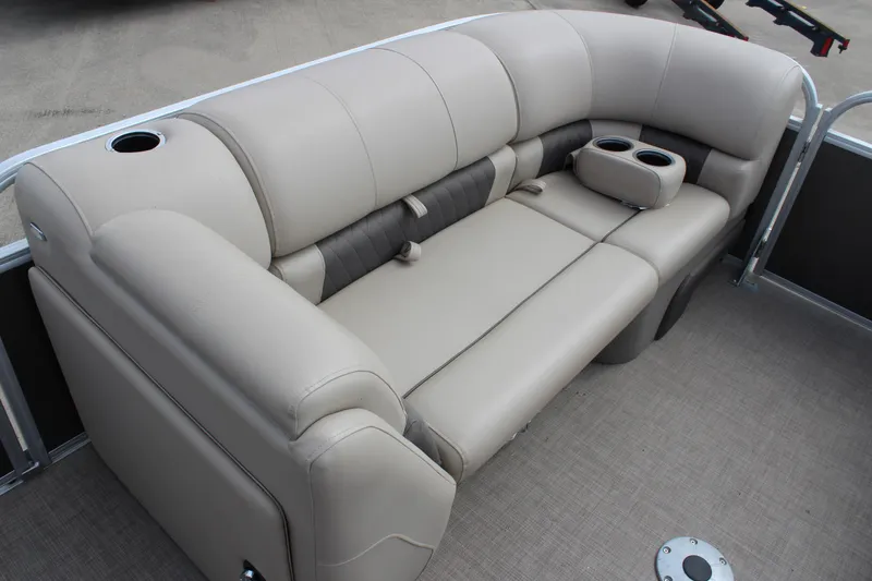 Slide: The Image of 2023 Sun Tracker Party Barge 22 DLX seating with cup holders and beige upholstery. - 10