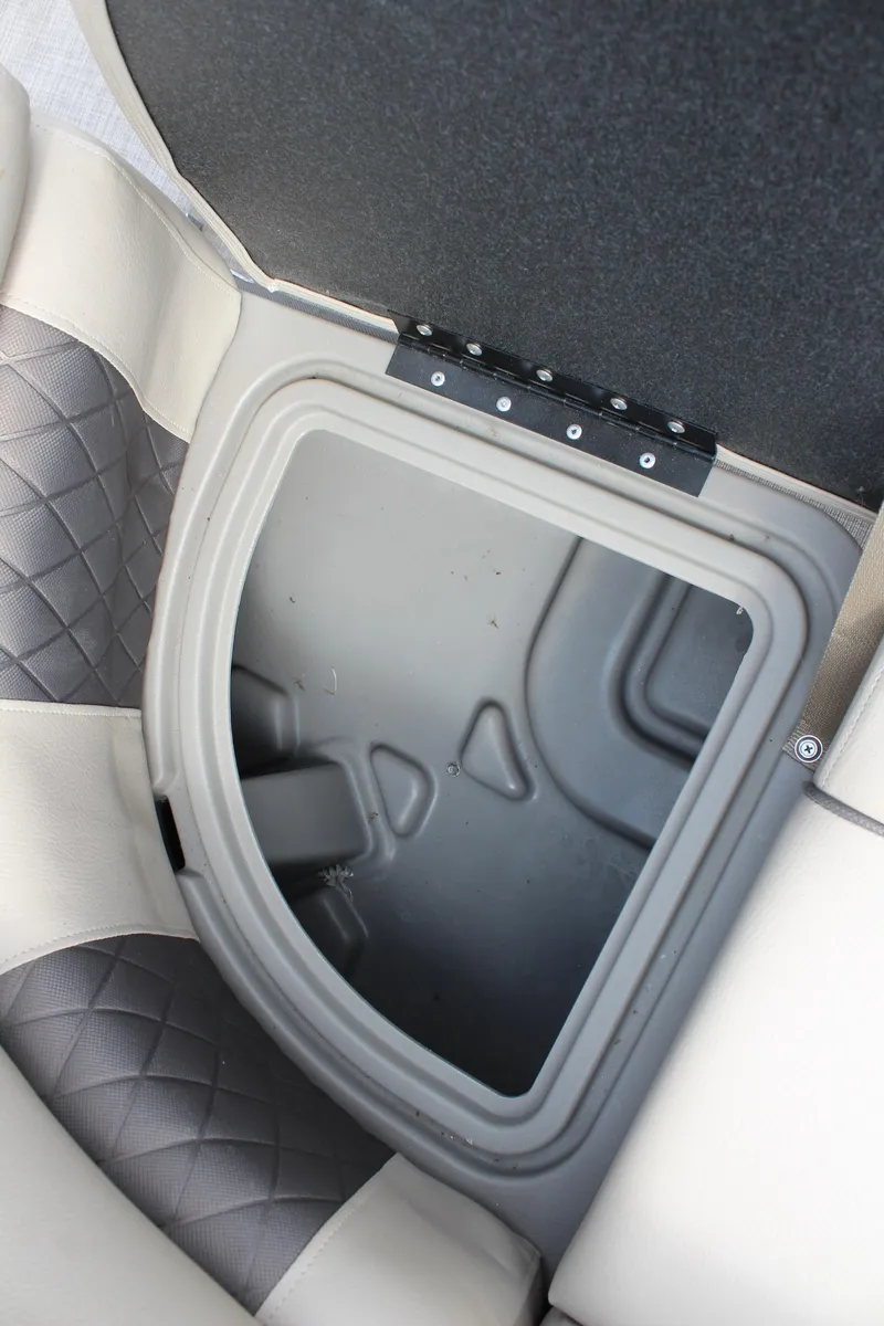 Slide: The Image of 2023 Sun Tracker Party Barge 22 DLX storage compartment with cushioned seating. - 17