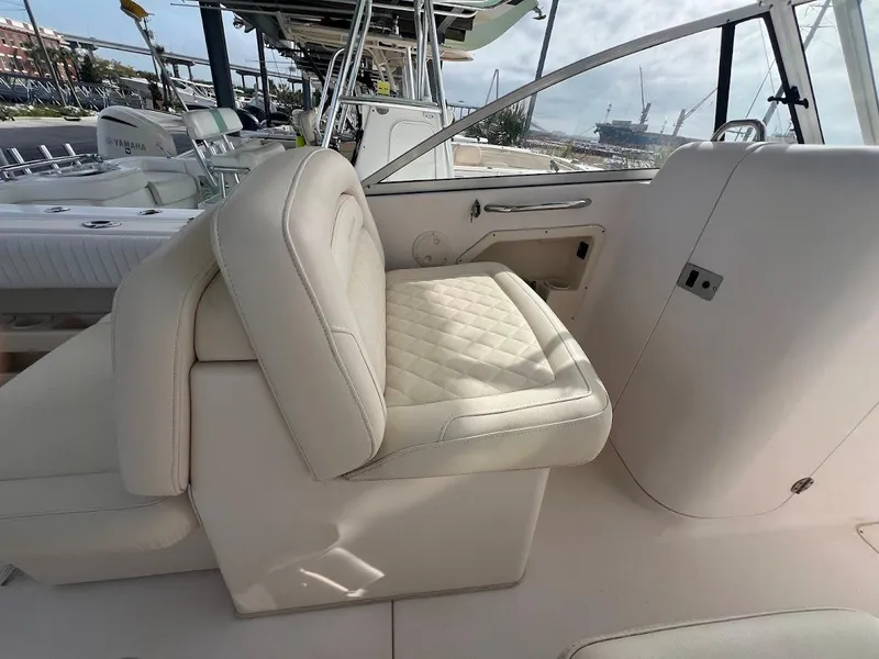 Slide: The Image of 2007 Grady-White Tournament 275 boat interior with cream leather seating. - 10