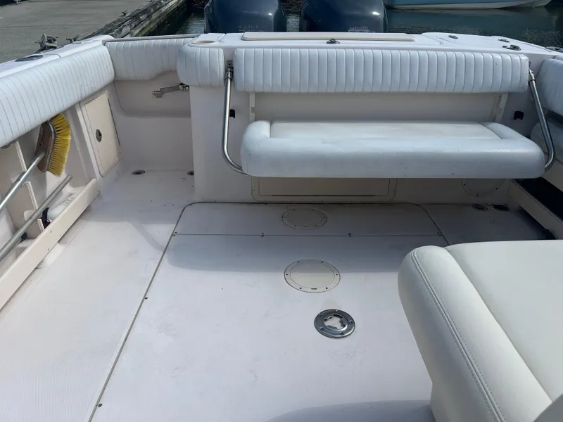 Slide: The Image of 2007 Grady-White Tournament 275 boat interior with white seating and deck. - 12